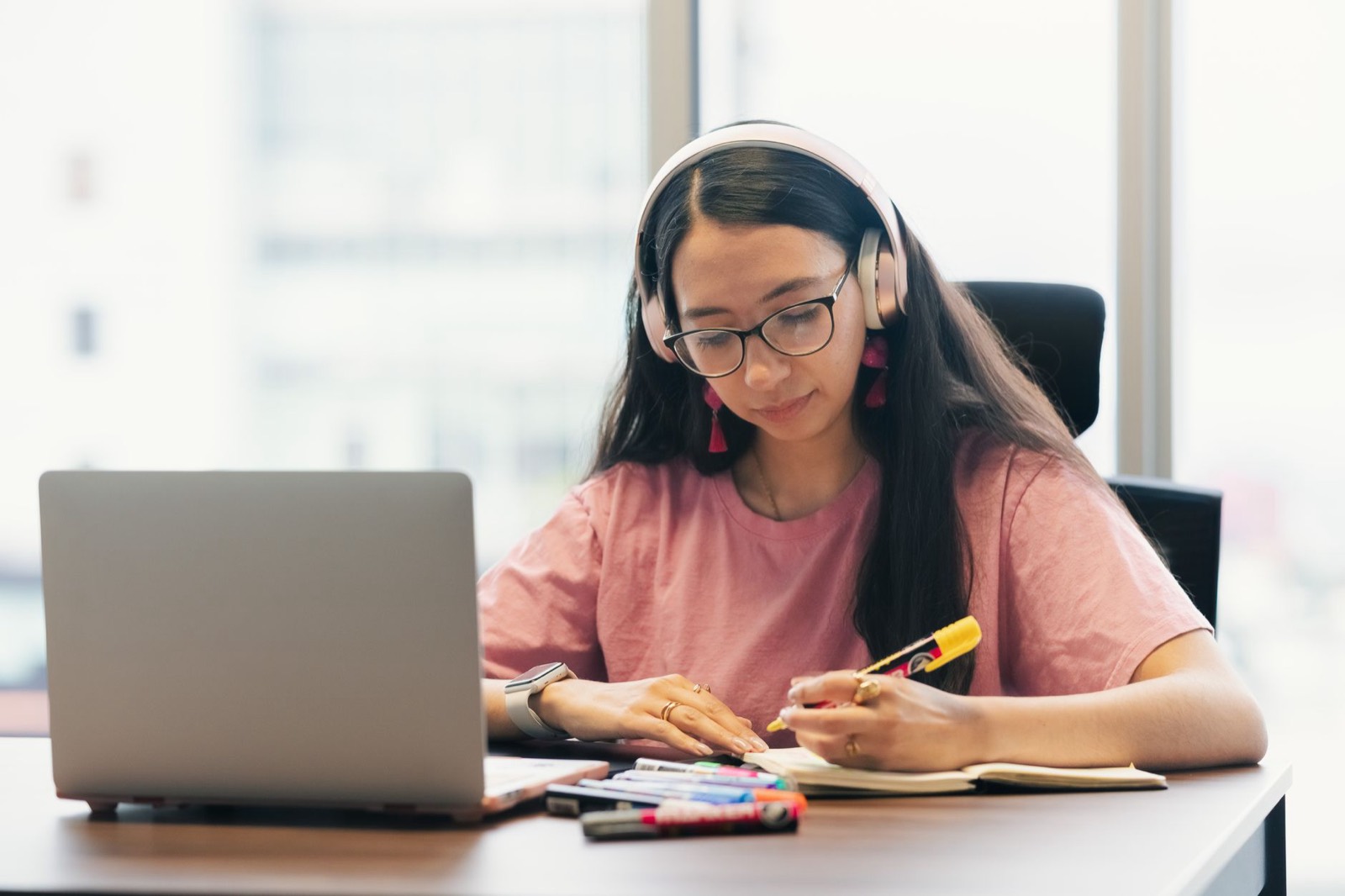 A student preparing for IELTS Speaking at a desk