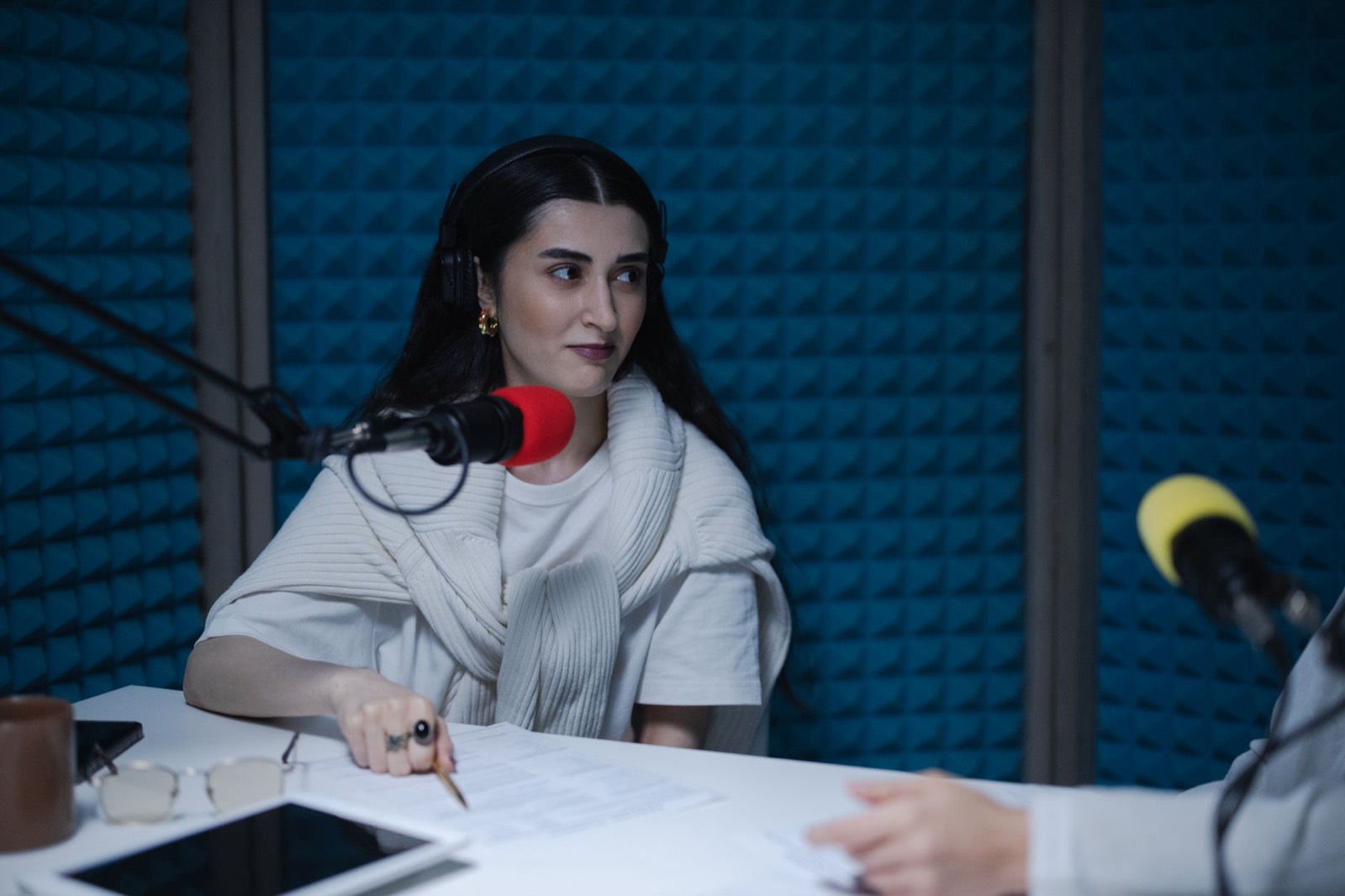 A person practising pronunciation by speaking into a microphone