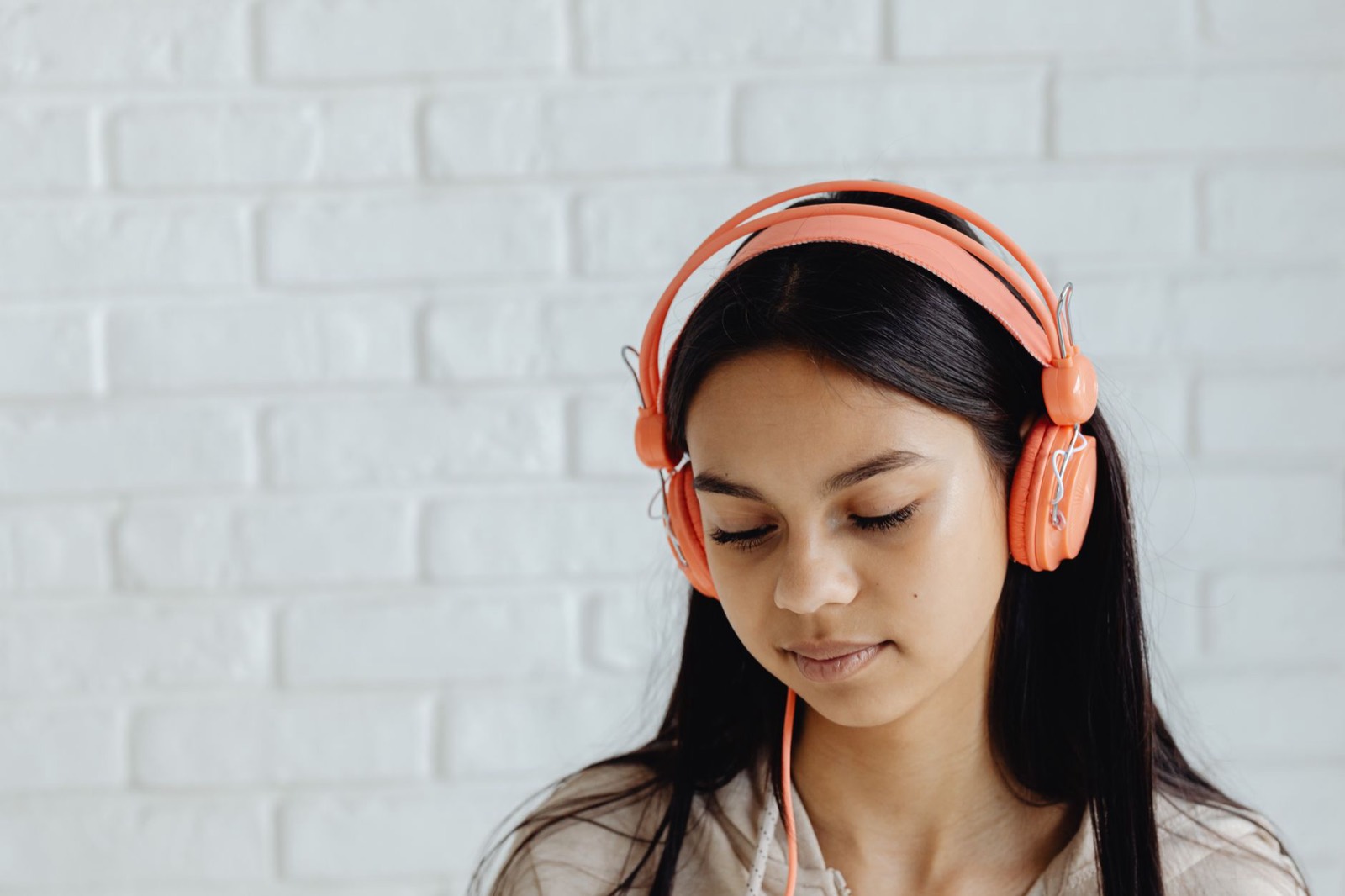Listening closely with headphones to shadow English